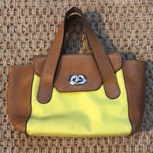 Micro neon green and tan purse.